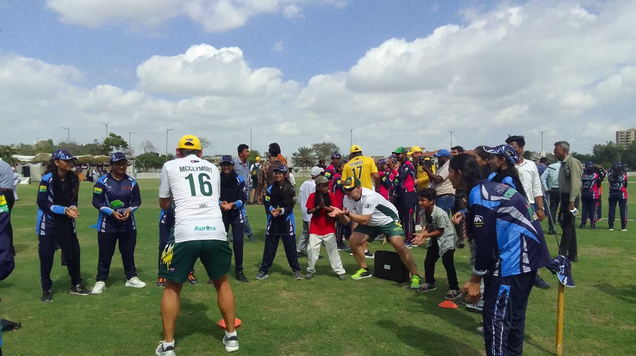 girls practicing with the australia over 40 world cup players at the australian high commission sponsored girls cup tournament at the national stadium photo natasha raheel